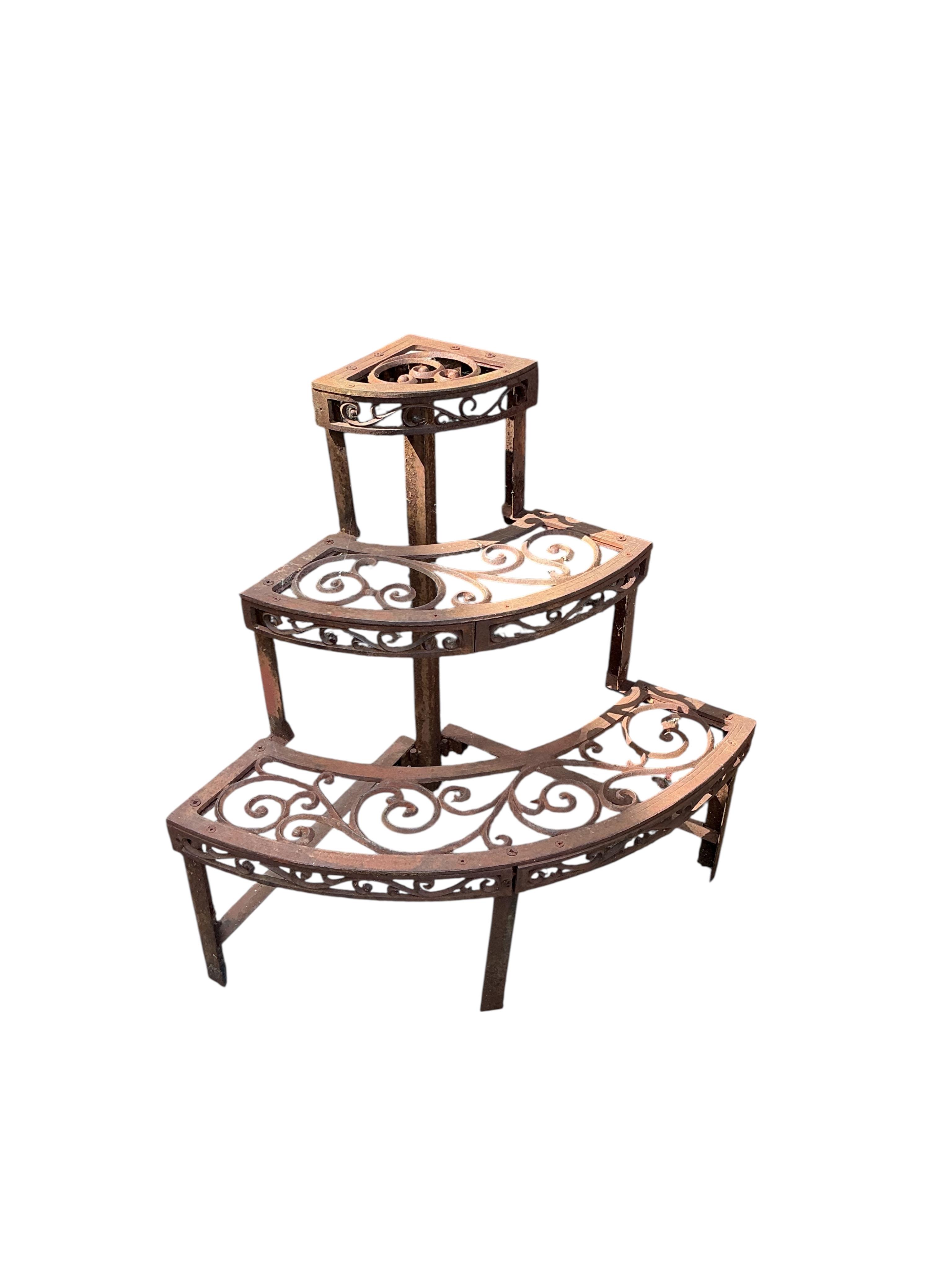 Two Victorian style cast metal pot stands, larger width 76cm, height 65cm